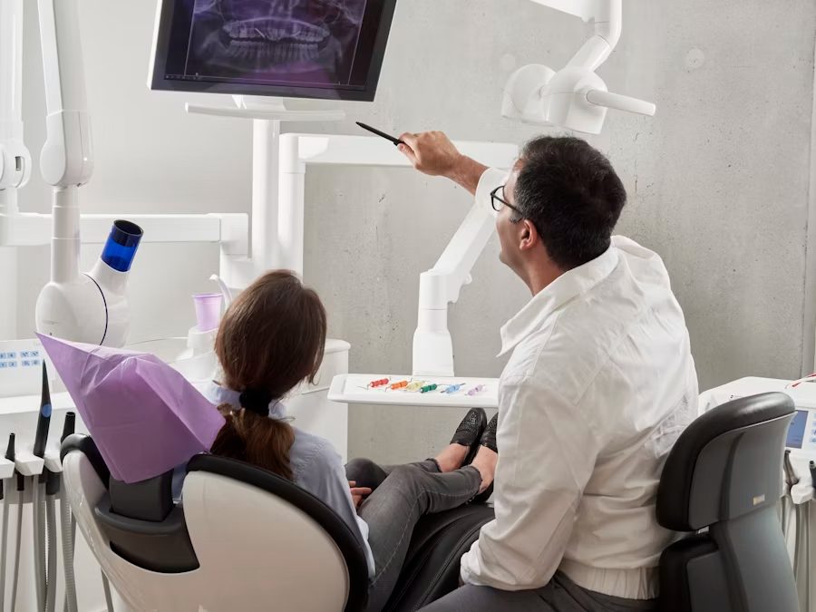 Dentist treating a patient at a Collin County clinic