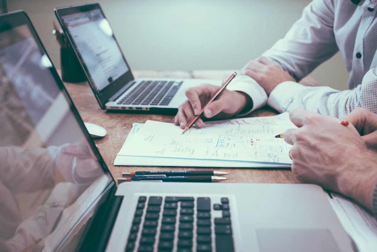 Financial advisers reviewing portfolio data at a McKinney firm